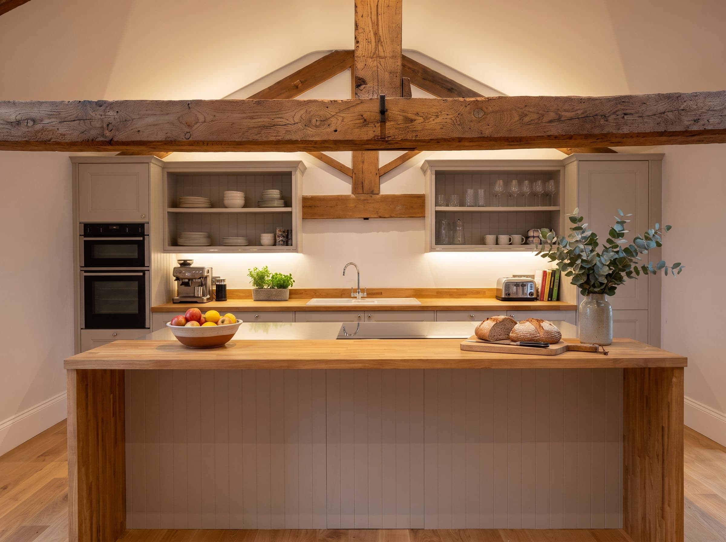 A hand-built oak kitchen of a Herdwick Barns home beneath centuries-old beams