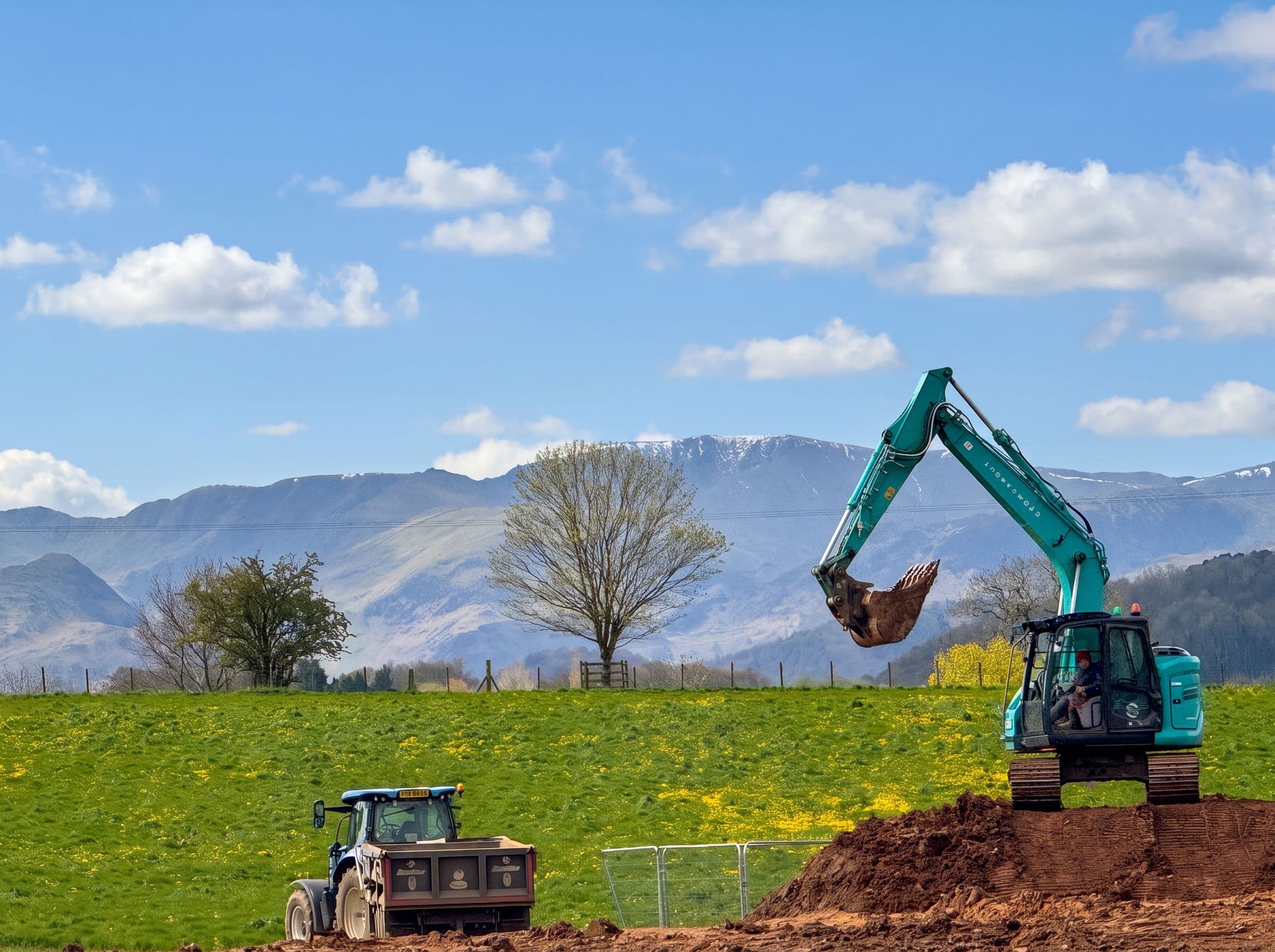 Groundworks underway on a Stoneswood site, with the Lakeland fells beyond